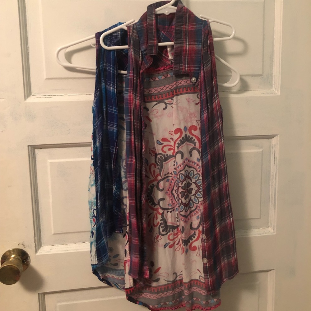 A pair of flannel sleeveless shirts